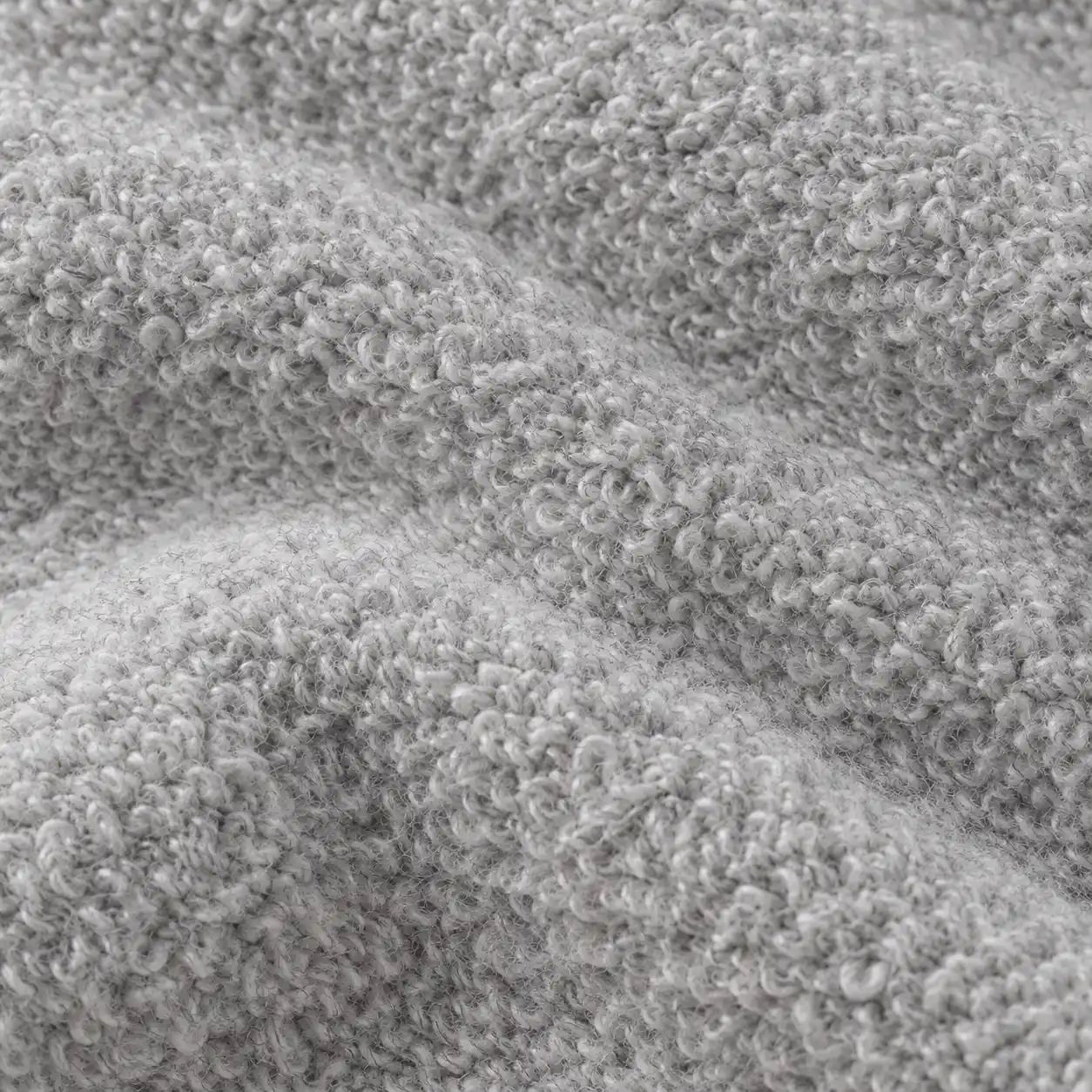 Close-up of the looped fleece on the inside of a grey hoodie.