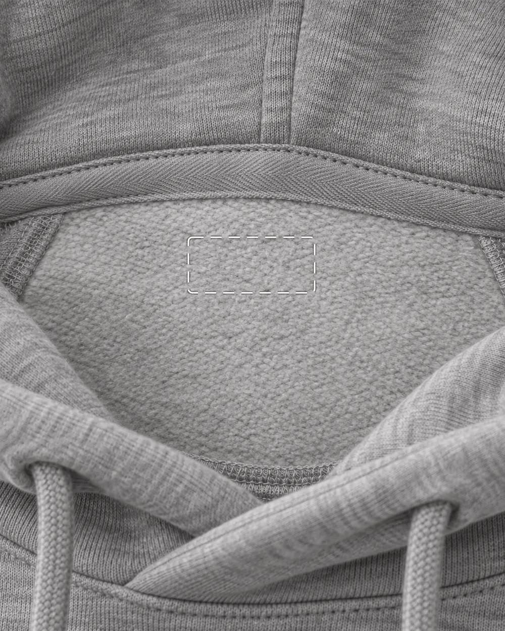 Inside the neck of a blank grey hoodie: the back-neck tape and the plain area where your woven label goes, outlined.