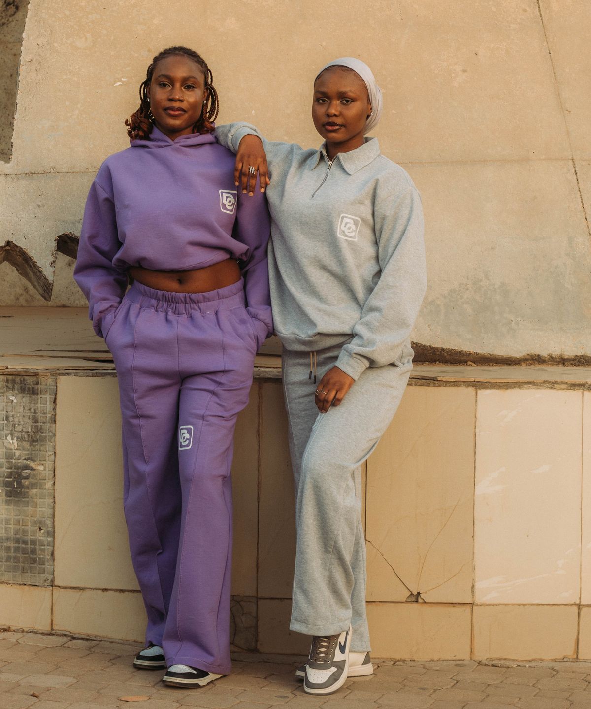 A matched two-piece tracksuit set worn outdoors.